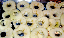 Drying apples at home - uncooked apple rings ready to go in the oven