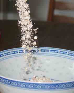 oats being poured in a bowl