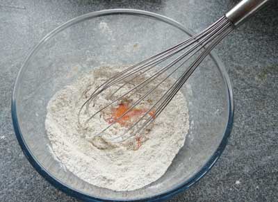 pancake making - stir the egg into the flour